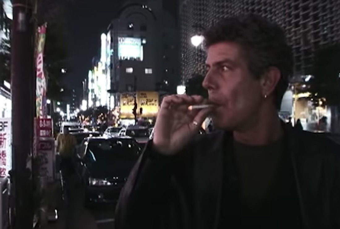 Anthony Bourdain smoking a sigarette in Tokyo